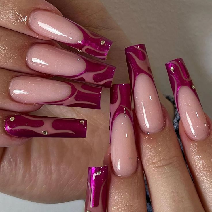 Dynamic Bold Nail Design with Glossy Pink and Vibrant Purple Hues and Metallic Accents.