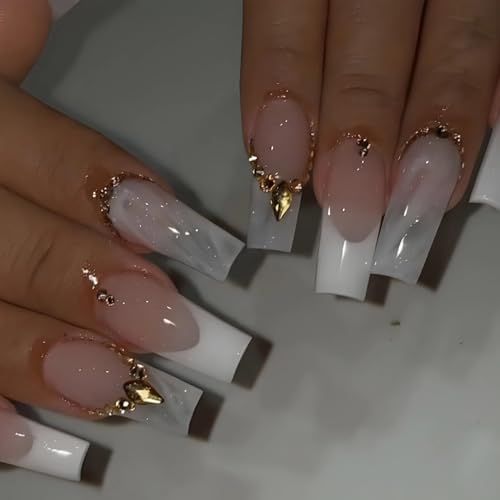 Sophisticated Nail Design with Soft Pink, Striking White Tips, Marble Accents, and Glamorous Gold Embellishments.