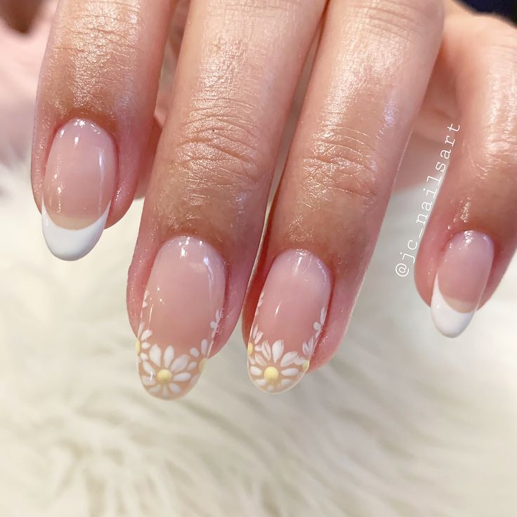 Charming Floral Nail Design with Nude Base and Elegant White Tips