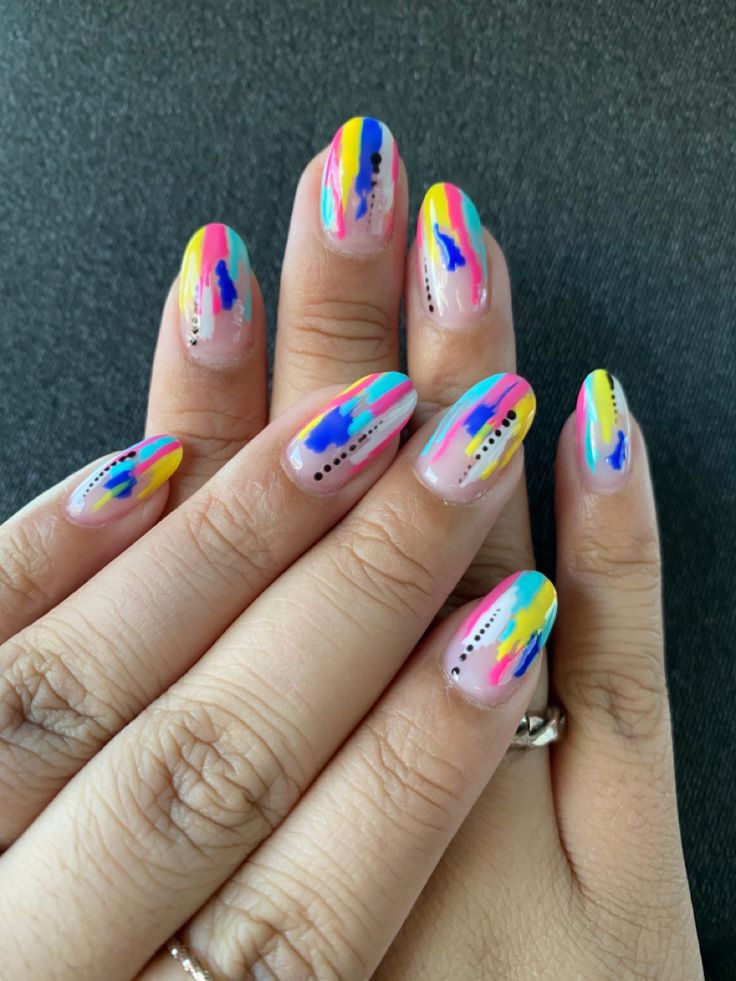 Vibrant Abstract Nail Art Design with Playful Color Blends and Black Dot Accents