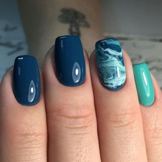 Elegant Nail Design with Navy Blue and Teal Marble Accents