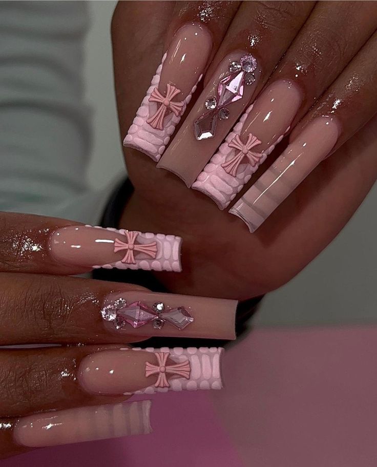 Elegant Chic Pink Nail Design with Textured Embellishments and Glimmering Accents.