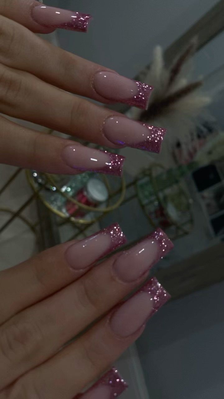 Sophisticated Nude Tip Nail Design with Shimmering Pink Glitter Finish.