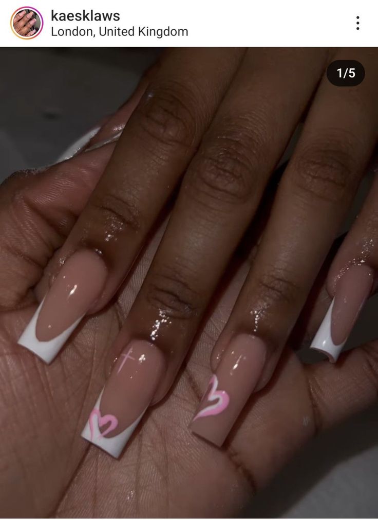 Chic Nude and White Nail Design with Playful Pink Heart Motifs.