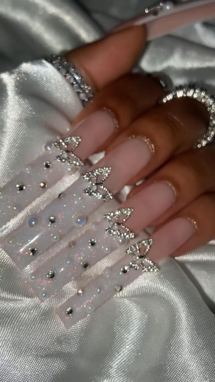 Elegant Nail Art with Intricate Designs and Sparkling Accents for Glamorous Occasions