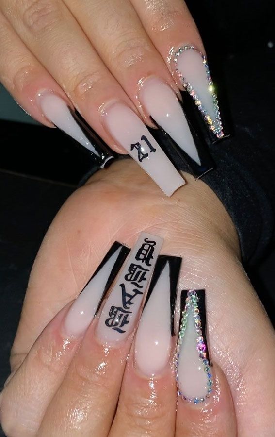 Glamorous Stiletto Nail Design with Translucent Gradient and Bold Black Tips