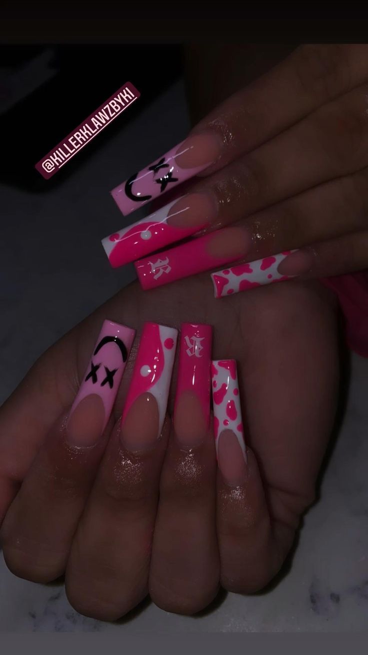 Trendy Vibrant Pink and White Nail Design with Bold Patterns and Mixed Finishes.