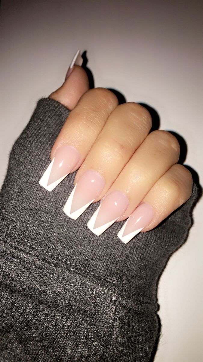 Sophisticated Almond-Shaped French Manicure: Soft Pink Base with Crisp White Tips.