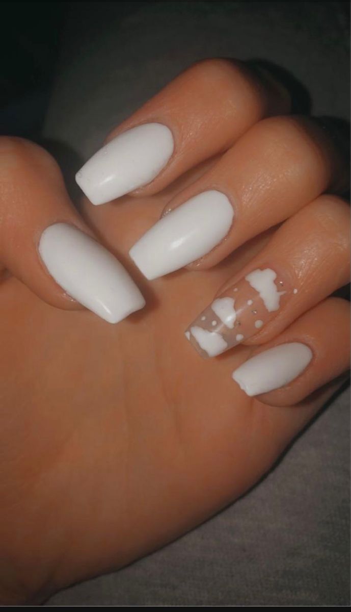 Chic White Manicure: Sleek Nails with Whimsical Cloud Accent.