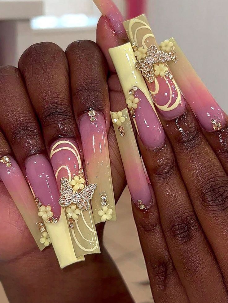 Chic Pastel Nail Design with Floral Accents and Rhinestones.