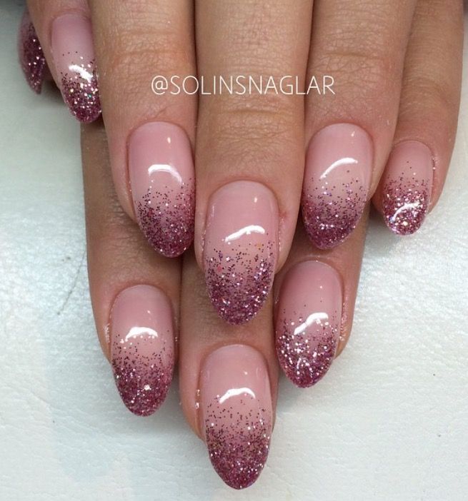 Elegant Glitter Ombre Nails: A Sparkling Blend of Nude and Pink for Any Occasion.