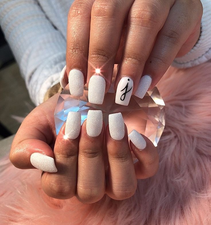 Elegant Matte White Nail Design with Minimalist Black Accent for Modern Sophistication.