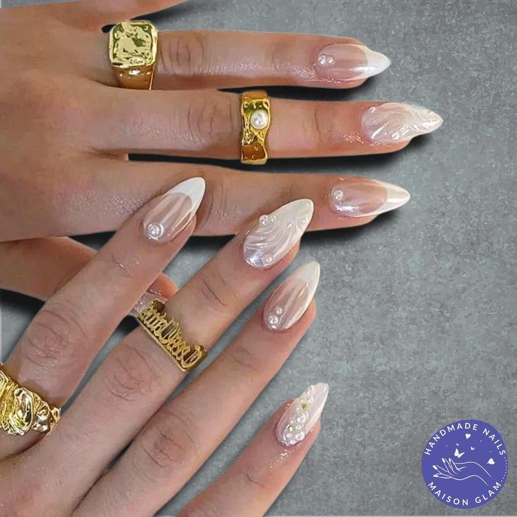 Sophisticated Almond-Shaped Ombre Nail Design with Elegant Patterns and Pearls for Special Occasions.