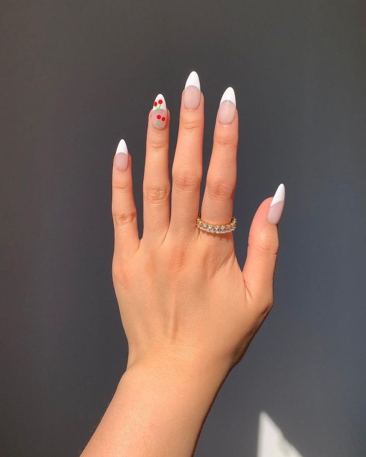 Chic Pastel French Tip Nails with Whimsical Accent Patterns and Gold Ring Accent.