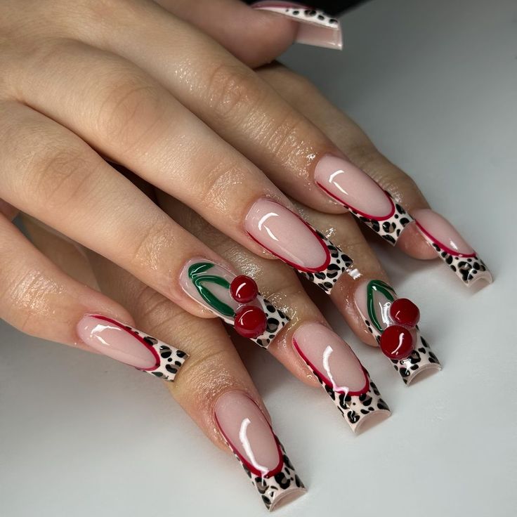 Playful Chic Nail Design: Black and White Animal Print with Cherry Accents