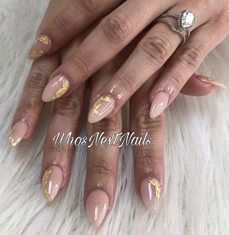 Sophisticated Almond-Shaped Nails with Nude Base and Gold Accents for Glamorous Elegance.