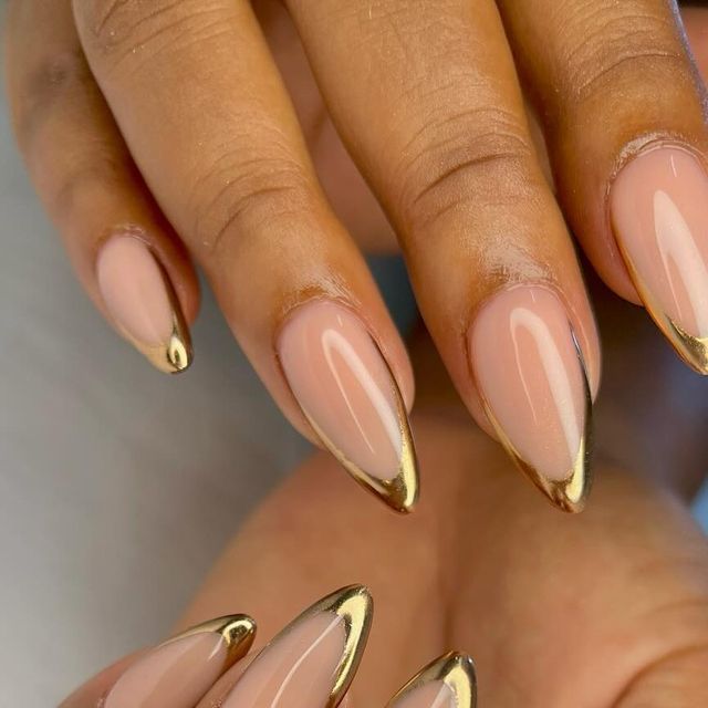 Chic Elegant Stiletto Nails: Nude Base with Glamorous Gold Tips for Any Occasion