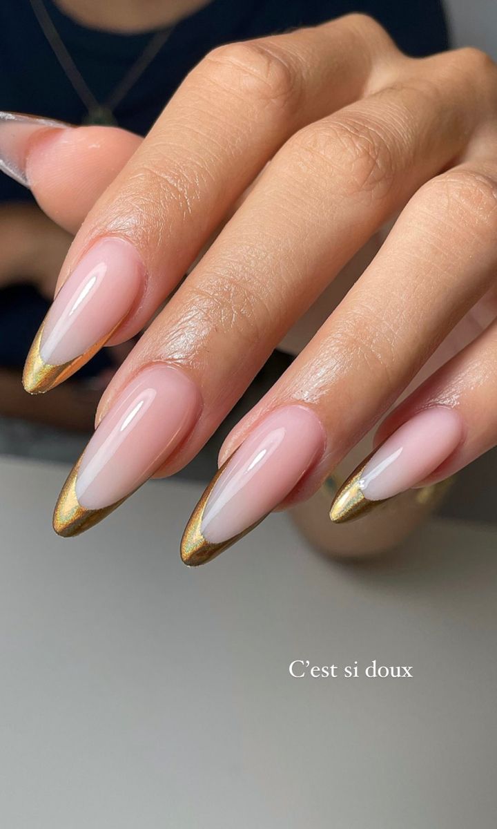 Sophisticated Ombre Almond Nails with Luxurious Gold Tips for Special Occasions.