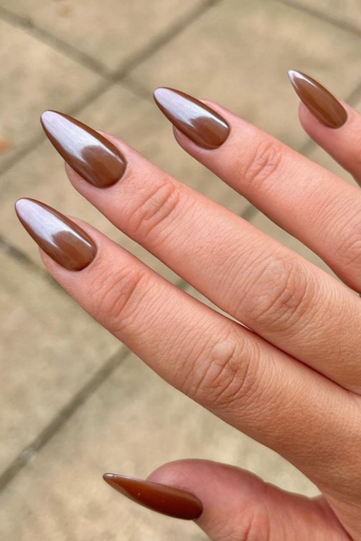 Sophisticated Almond-Shaped Nails: Glossy Brown with Metallic Sheen and Gradient Effect.