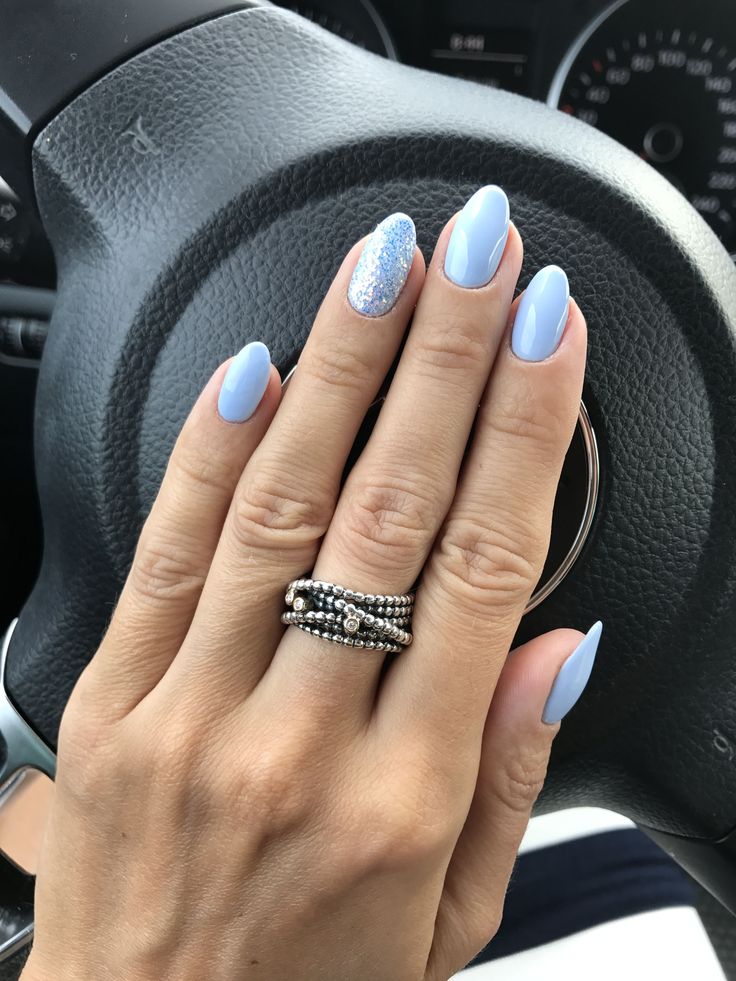 Chic Pastel Blue Nail Design with Sparkly Accent for a Glamorous Touch.