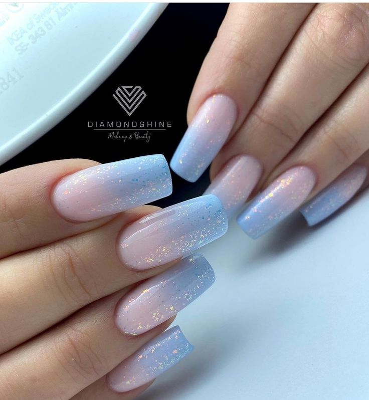 Elegant Ombre Nail Design in Soft Pastels with Sparkling Gradient.