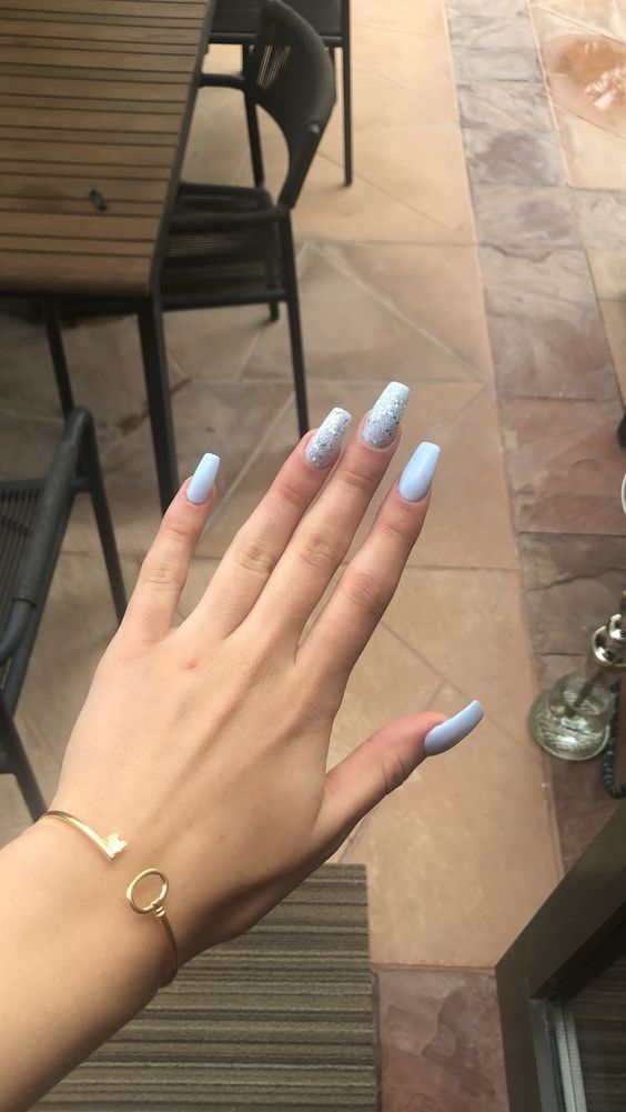 Elegant Pastel Blue Nail Design with Sparkling Accent for Any Occasion