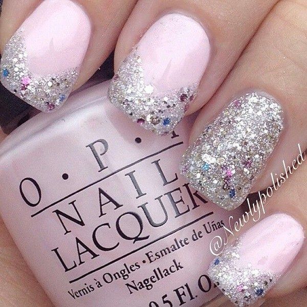 Elegant Ombre Nail Design: Soft Pink Base with Dazzling Silver Glitter Accent for Festive Occasions.