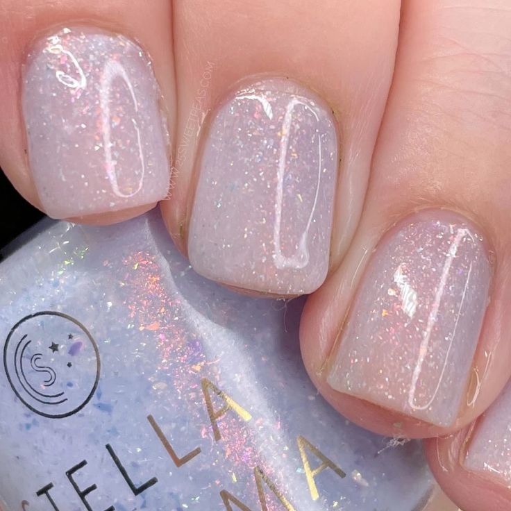 Dreamy Sparkly Pastel Nail Design with Iridescent Finish for Chic Elegance.