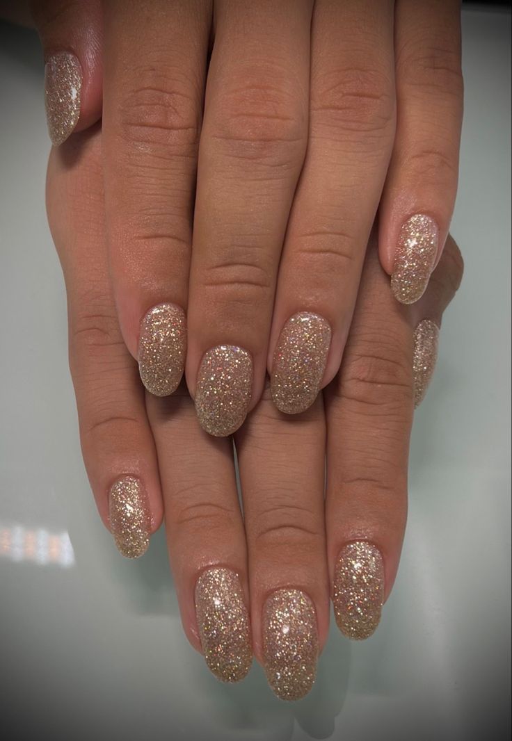 Elegant Glitter-Enhanced Oval Nails for Glamorous Occasions