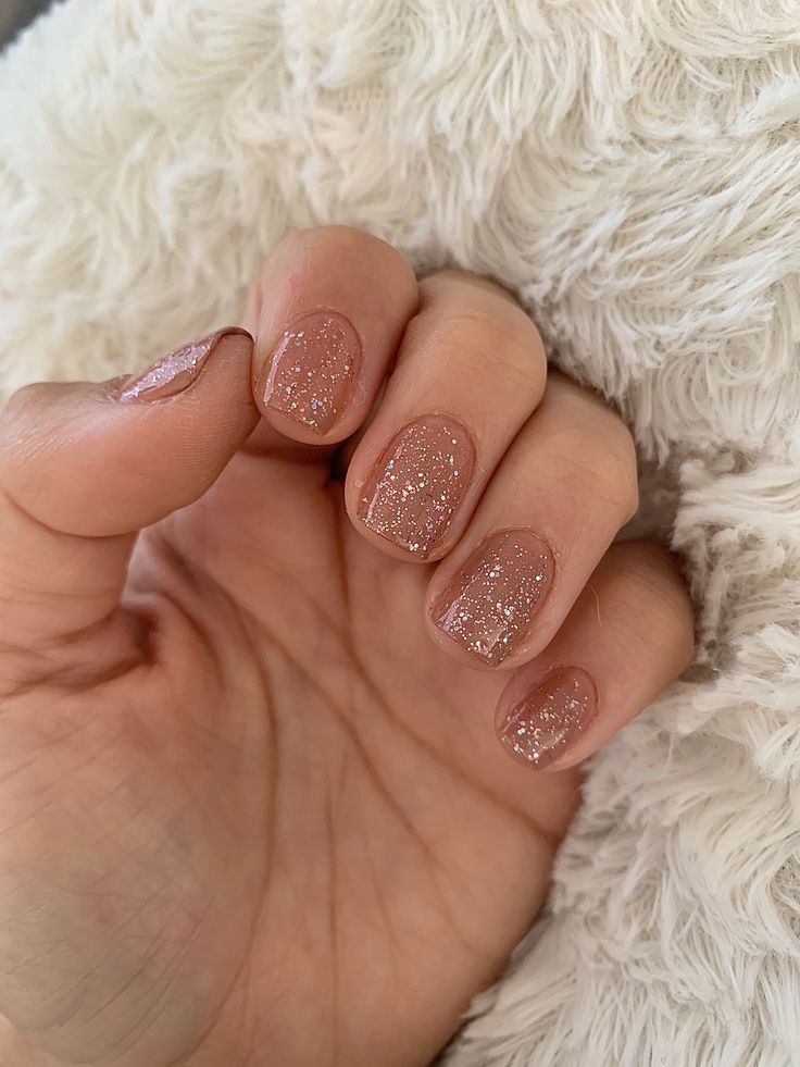 Elegant Glittery Nude Nails: A Sophisticated Touch for Any Occasion