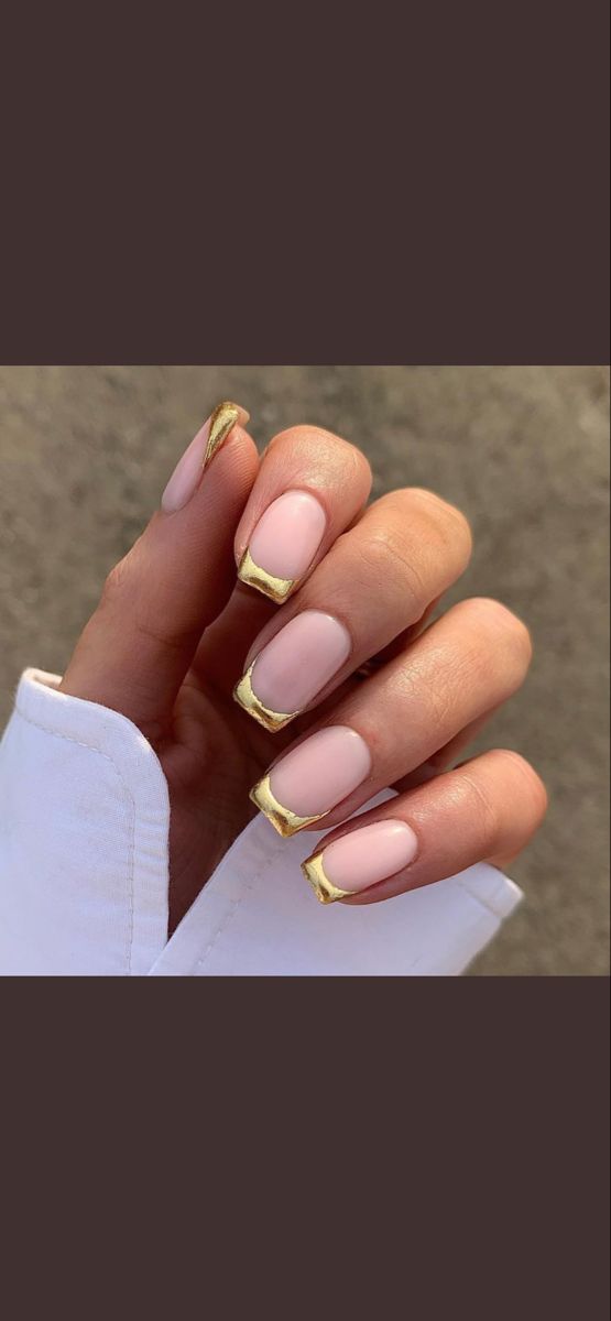 Elegant Soft Pink Nail Design with Striking Gold Accents and Sophisticated Tips.