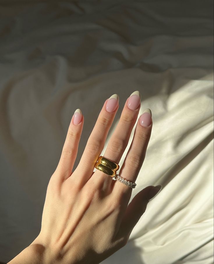 Chic French-Tip Nails with Glossy Nude Base: Elegant and Versatile Manicure.