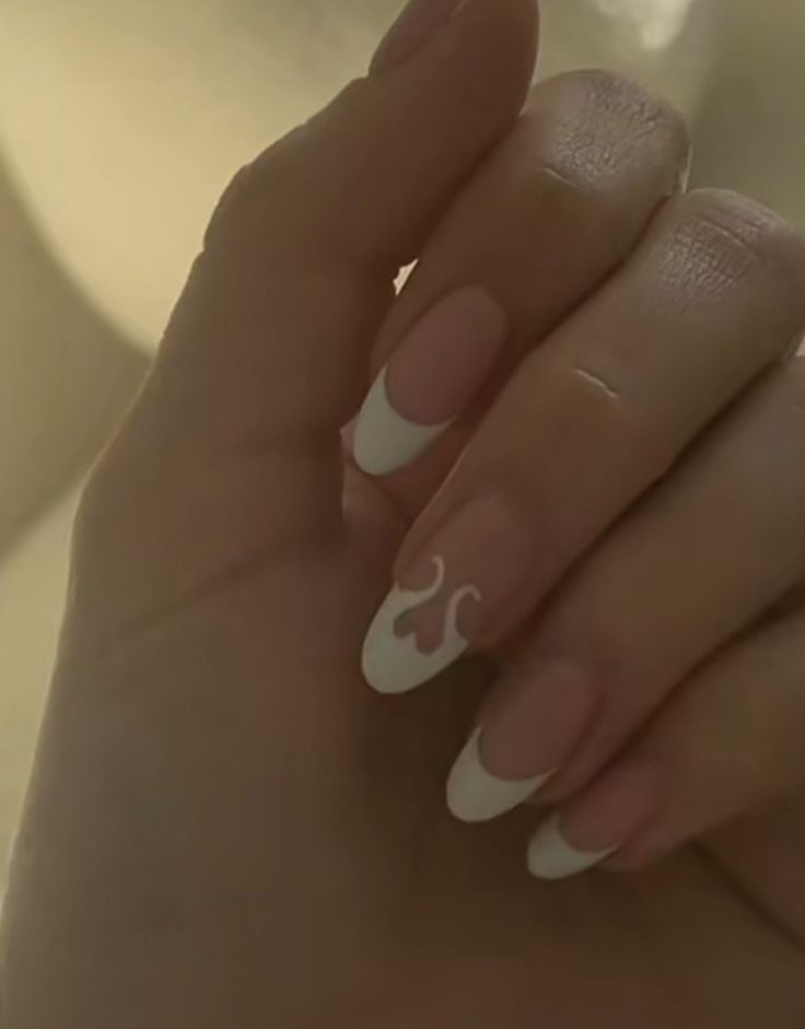 Elegant French Tip Nail Design with Heart Accents in Soft Nude.