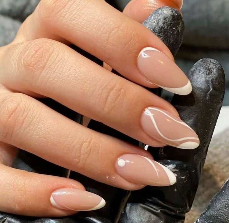 Sophisticated Almond-Shaped Nails with Soft Nude Base and Whimsical White Accents