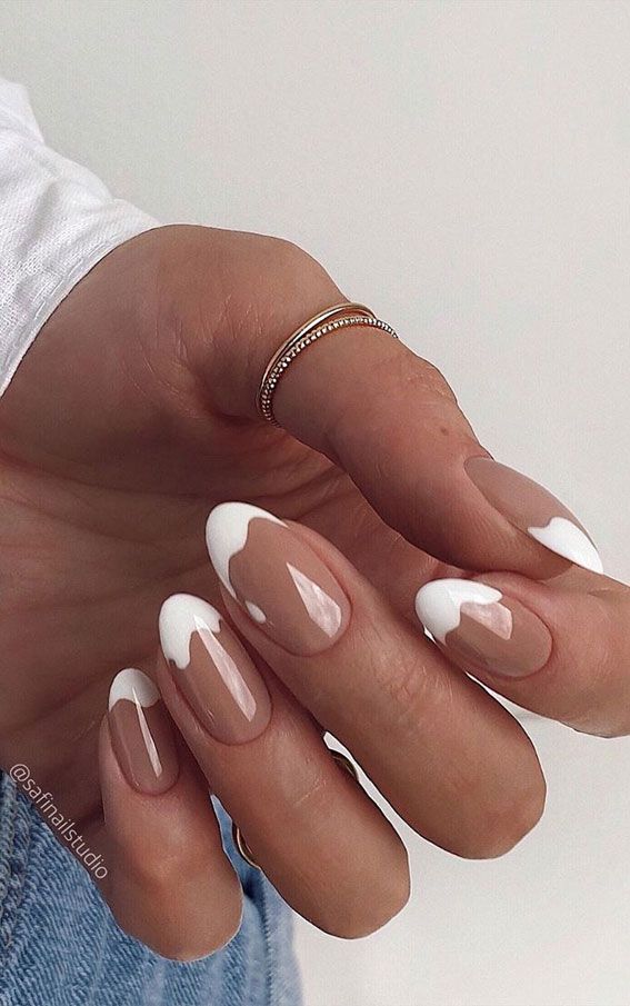 Chic Nude and White Tip Manicure with Playful Drip Design for Elegant Creativity.