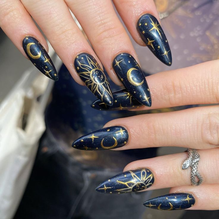 Celestial-Inspired Nail Design: Navy Base with Gold Moons and Stars