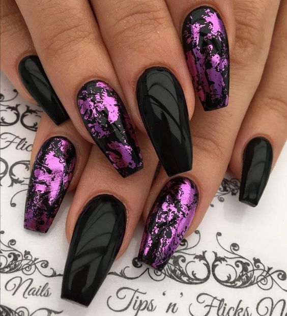 Dramatic Almond-Shaped Nail Design: Glossy Black and Vibrant Purple Metallic Accents.