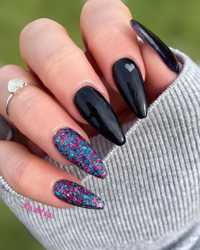 Charming Black and Glitter Nail Design with Heart Accent and Colorful Hues