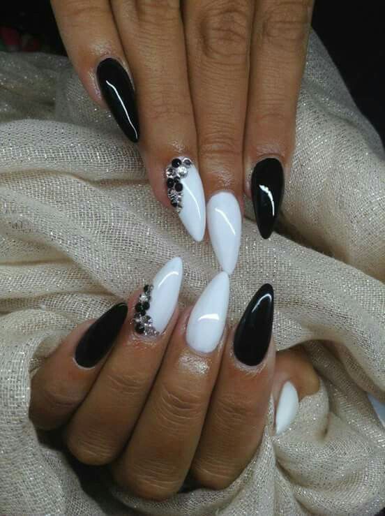 Elegant Black and White Nail Design with Glossy Finishes and Rhinestone Embellishments