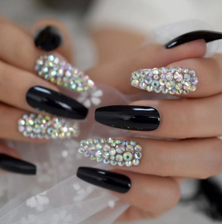 Glamorous Black Nails with Sparkling Rhinestones for a Bold Statement.