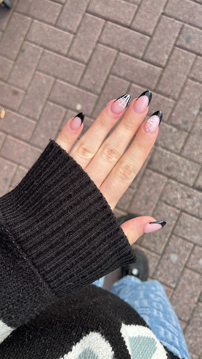 Chic and Playful Nail Design: Black Tips, Soft Pink Base, and Modern Geometric Patterns