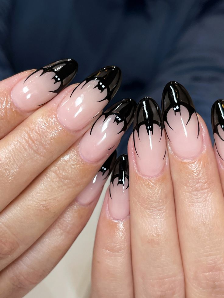 Chic Two-Tone Nail Design: Bold Nude and Glossy Black with Intricate Tips