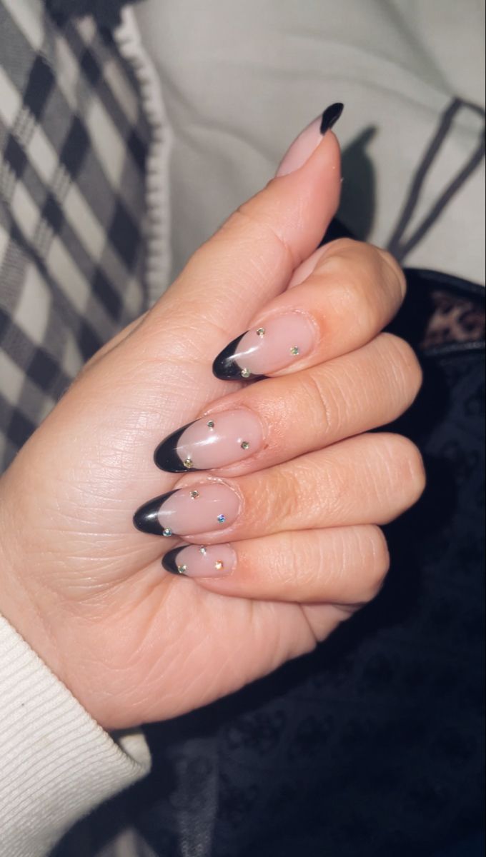 Chic Black-Tipped French Nails with Sparkling Rhinestones for Elegant Style.