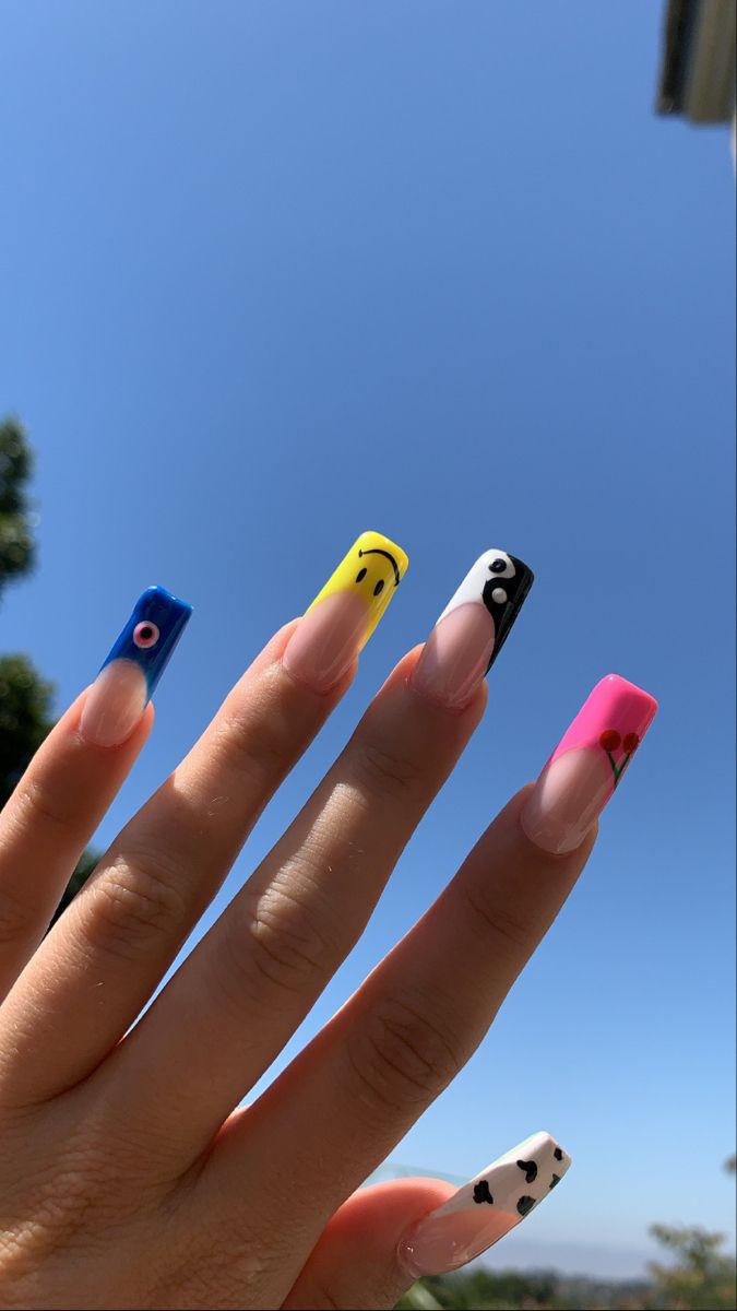 Vibrant and Eclectic Nail Art: A Playful Mix of Patterns and Colors