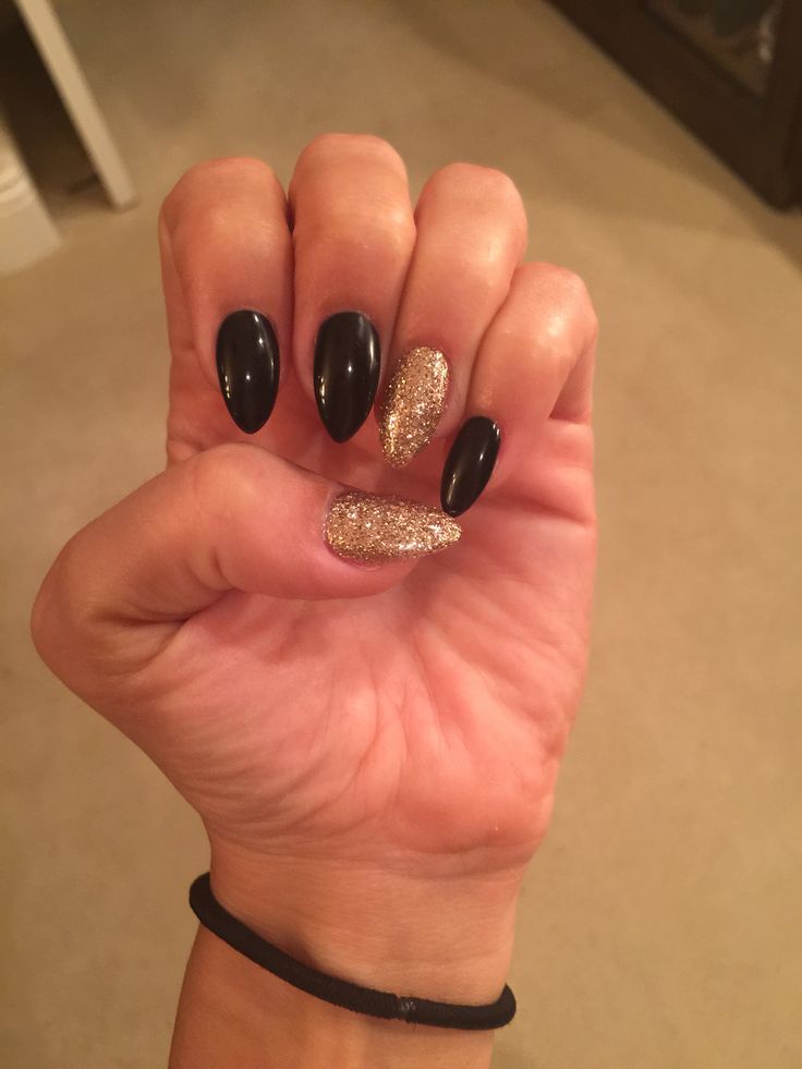 Chic Black and Gold Almond Nail Design for Any Occasion