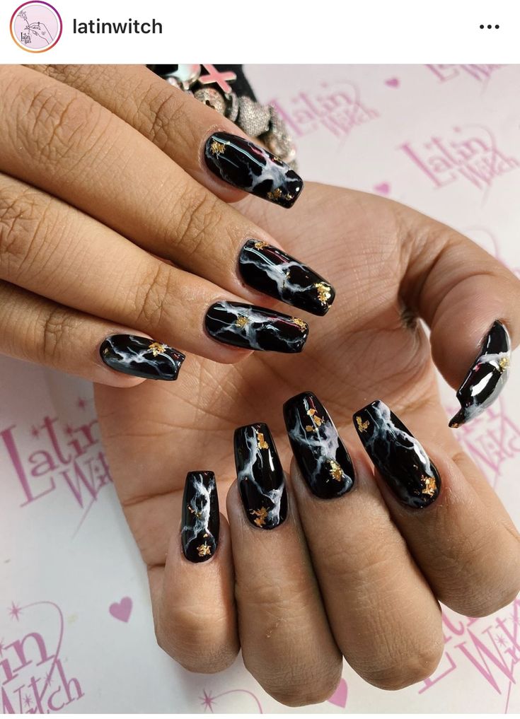 Elegant Black and Gold Marbled Coffin Nail Design