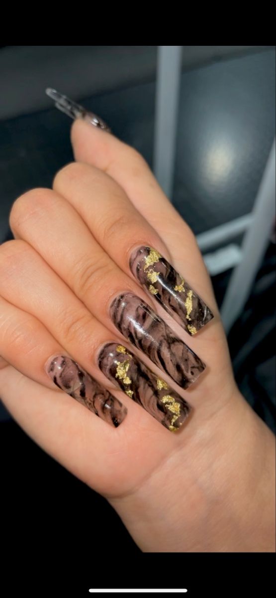 Luxurious Brown Marble Nail Design with Glamorous Gold Foil Accents