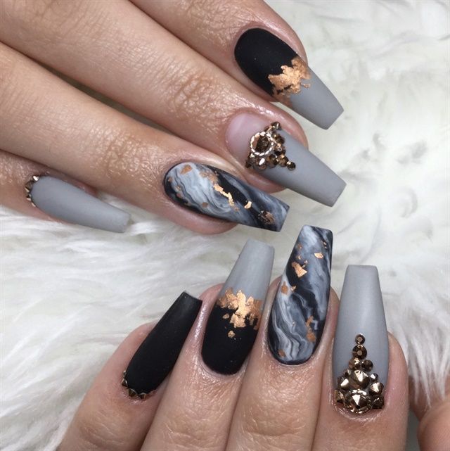 Sophisticated Nail Design: Matte Black and Soft Gray with Marble Patterns and Luxurious Gem Accents.