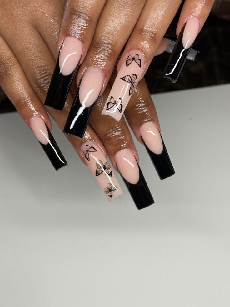 Elegant Long Square Nails: A Striking Blend of Nude and Black with Delicate Bow Motifs.