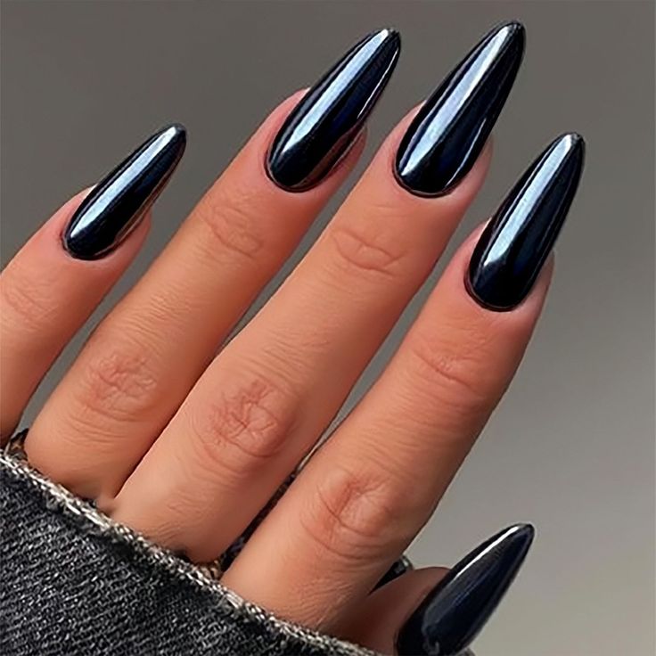 Elegant Black Stiletto Nails: High-Gloss Drama for Bold Style Statements.